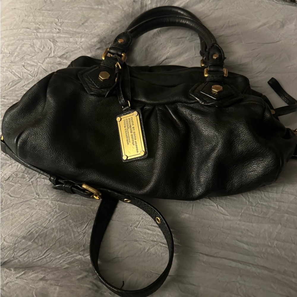 Marc Jacobs cross body purse. Leather looks good but dirty inside from use.